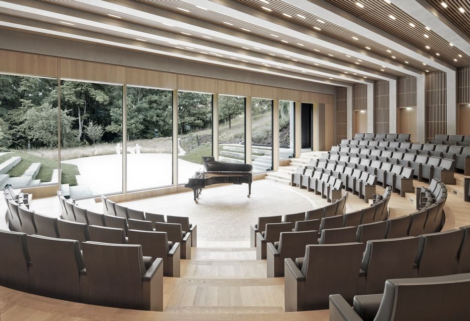 The auditorium at the Baierbrunn venue, glass wall onto the woods